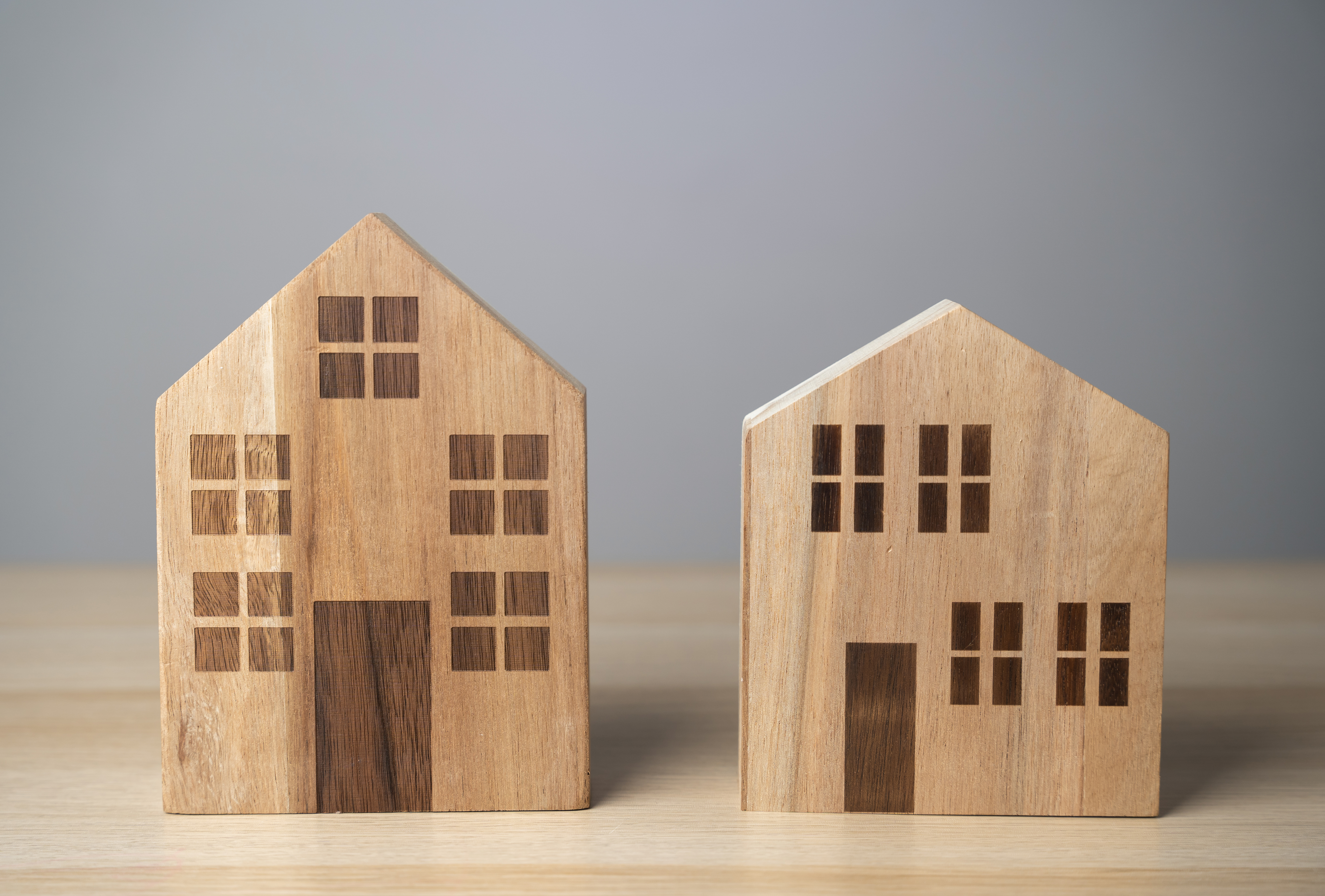 Two houses wooden figures buying and selling ho 2024 02 06 15 10 50 utc
